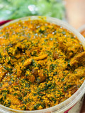 850ml Egusi soup with goat meat and assorted meats, served with a medium portion of poundo yam