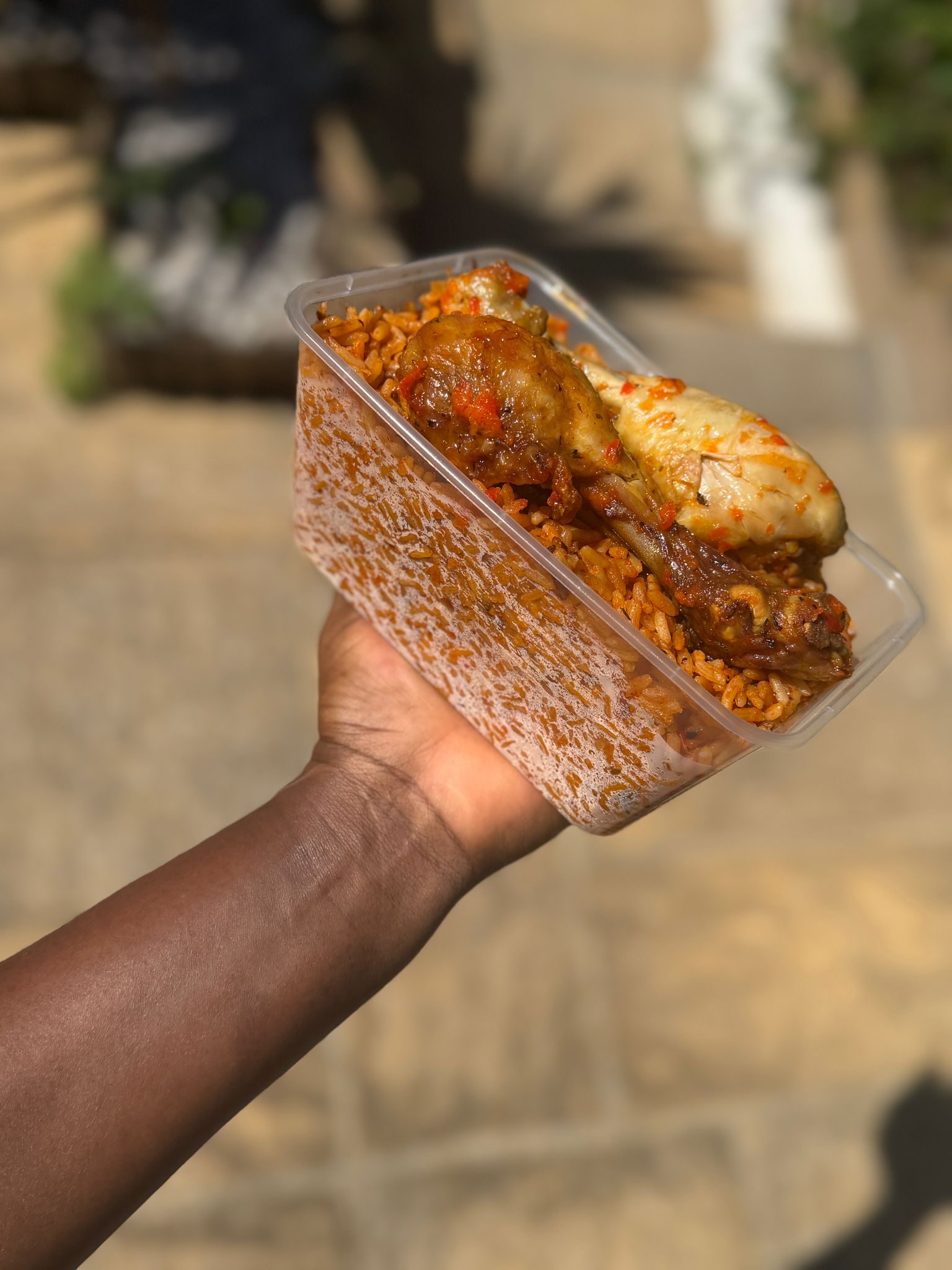 850ml Smokey party jollof rice with peppered Nigerian chicken and fried plantain(10pack)